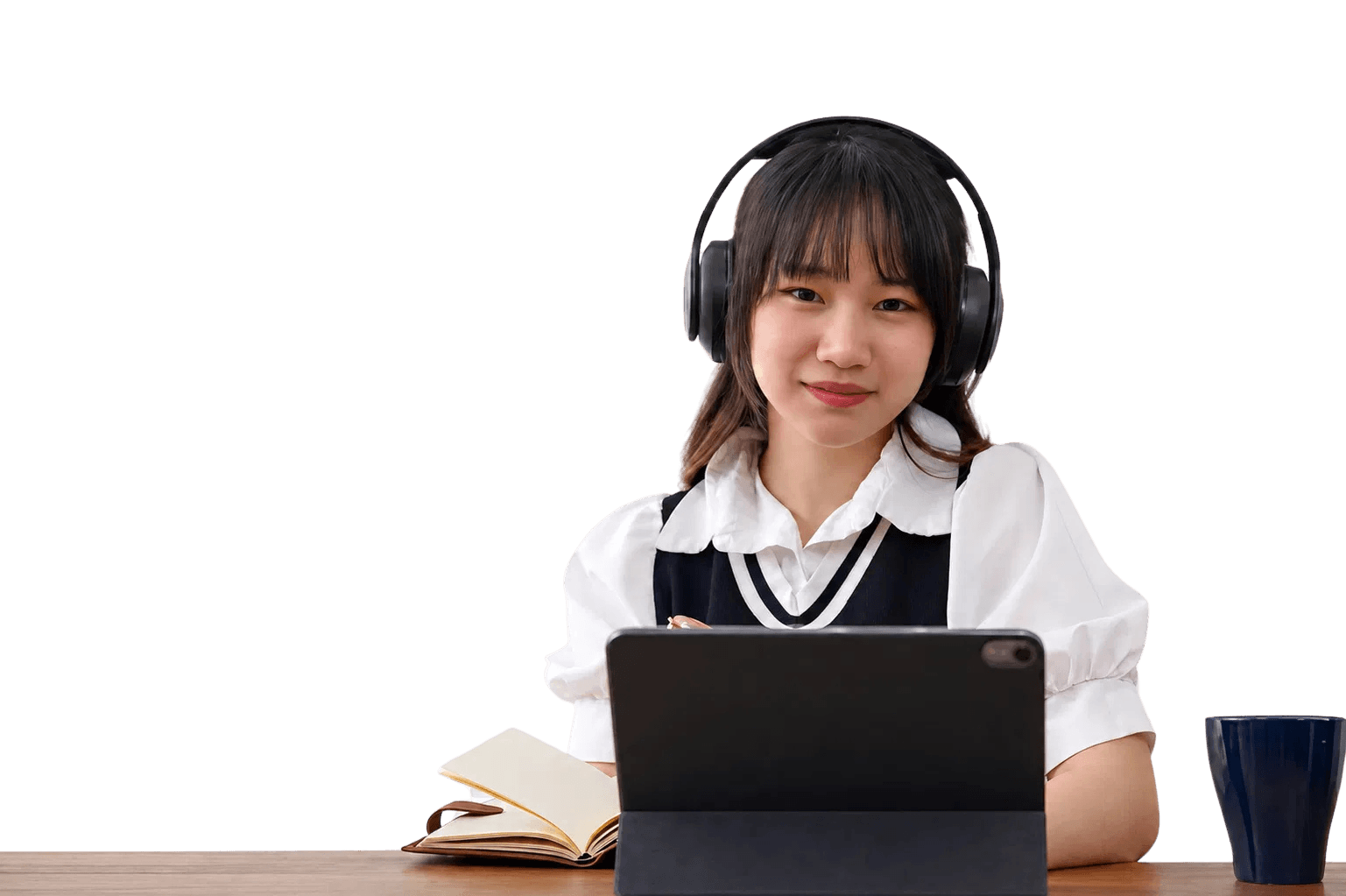 A student learning online with headphones and a tablet
